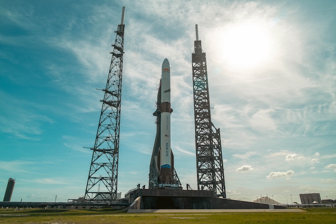 A view of the New Glenn rocket in the ready for launch configuration. The lightning tower at left was destroyed when the rocket blew up last week during an engine test firing, along with the transporter-erector holding the New Glenn in place. The large gantry at right was damaged in the blast but officials say it can be repaired in place. Image: Blue Origin